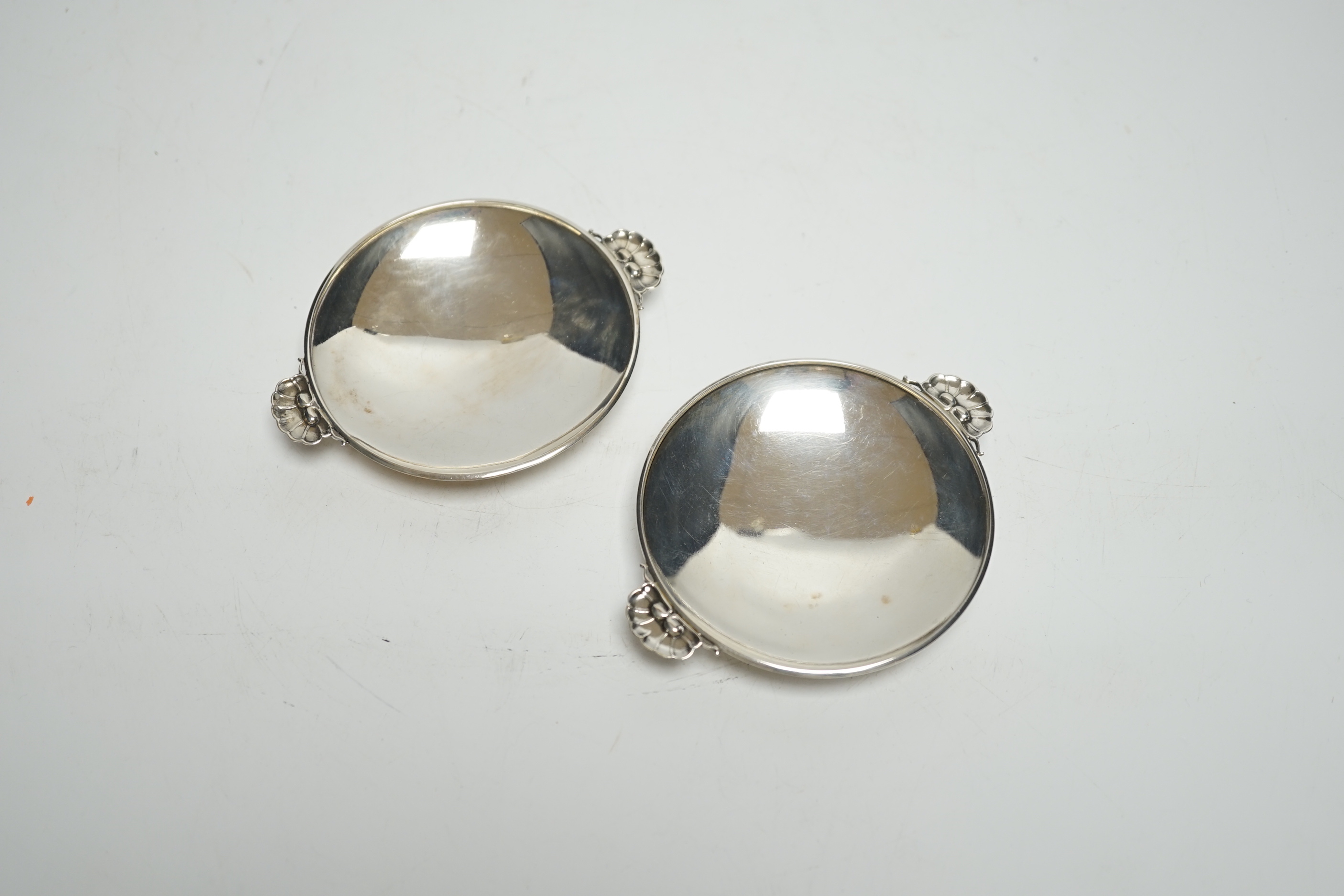 A pair of small 1930's Georg Jensen sterling dishes, with fluted lug handles, 94mm.